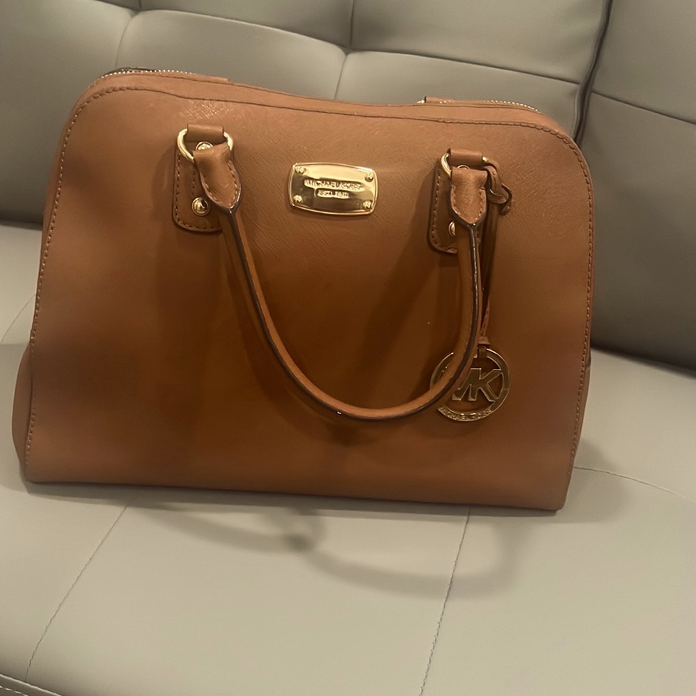 Like new Michael Kors purse,only use 1-2 times beautiful brown color